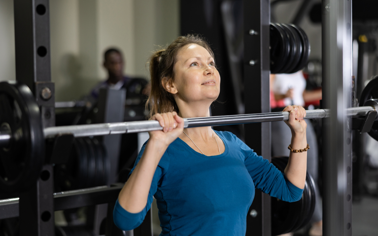Support longevity with active lifestyle - woman weightlifting