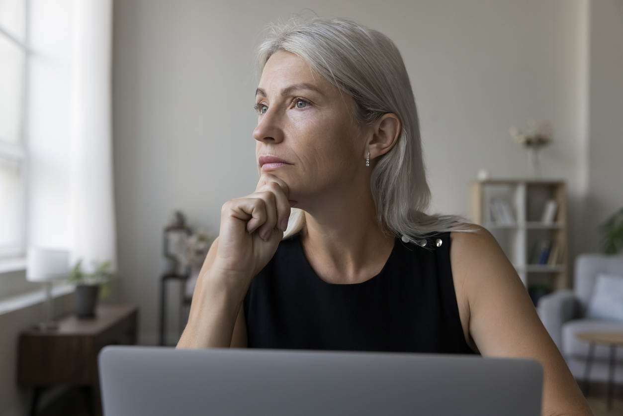 Woman thinking about financial mistakes during divorce